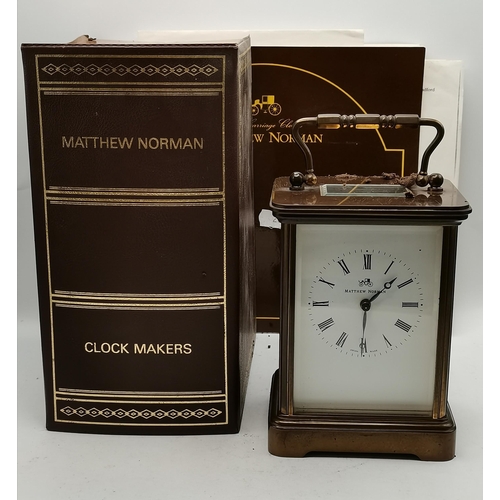 16 - A Matthew Norman Carriage Clock in Brass with box and key - H13.5cm