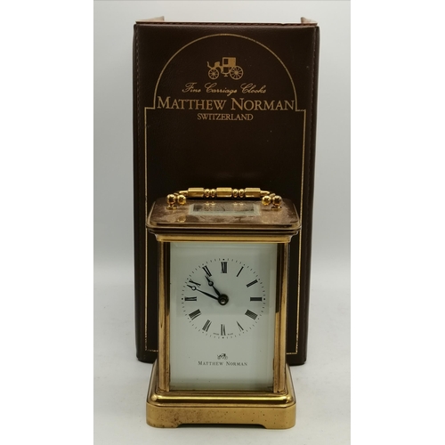 17 - A Matthew Norman Carriage Clock in Brass with box and key - H11cm