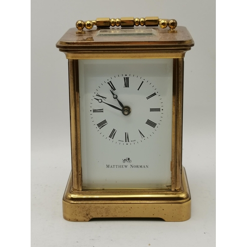 17 - A Matthew Norman Carriage Clock in Brass with box and key - H11cm