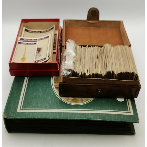 186 - A quantity of cigarette cards in an album, a leather box and a card box, including Turf Cigarettes '... 