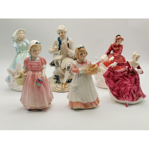 24 - A collection of Porcelain figurines including Royal Doulton and Coalport