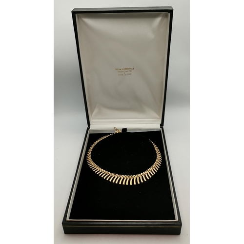 344B - A 9ct gold fancy necklace, the brick-link chain with graduated fringing, stamped '375' and hallmarke... 