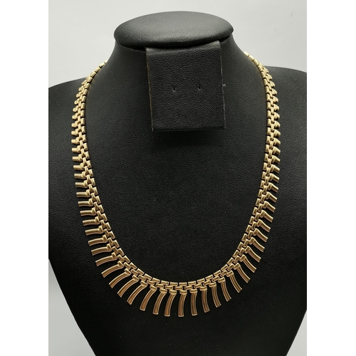 344B - A 9ct gold fancy necklace, the brick-link chain with graduated fringing, stamped '375' and hallmarke... 