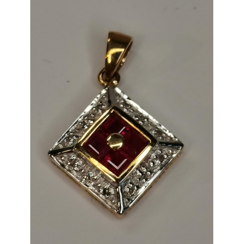 348 - A 9ct gold pendant with diamond and ruby stones