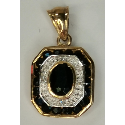 349 - A 9ct gold pendant with diamond and sapphire stones. W14mm, H15mm H including fob 23mm