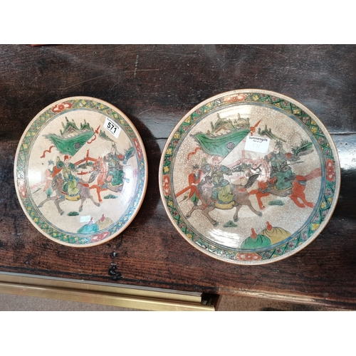 571 - A pair of Chinese crackle-glazed dishes, both decorated with two warriors on horseback, another figu... 