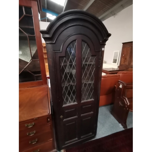 912 - A Jacobean style Antique oak corner cupboard with leaded glass decoration