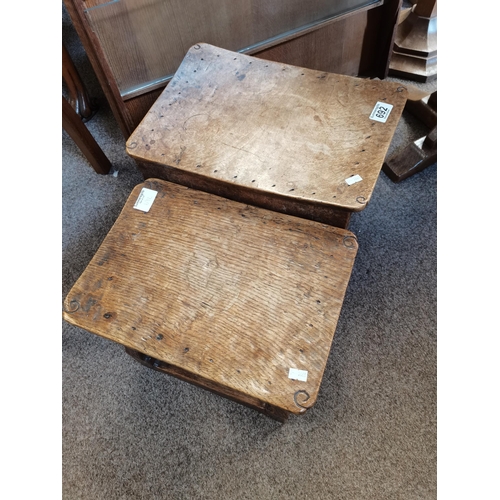 692 - Two oak dish top stools, possibly by Wilf Hutchinson, lightly adzed, each with nailed top, on four s... 