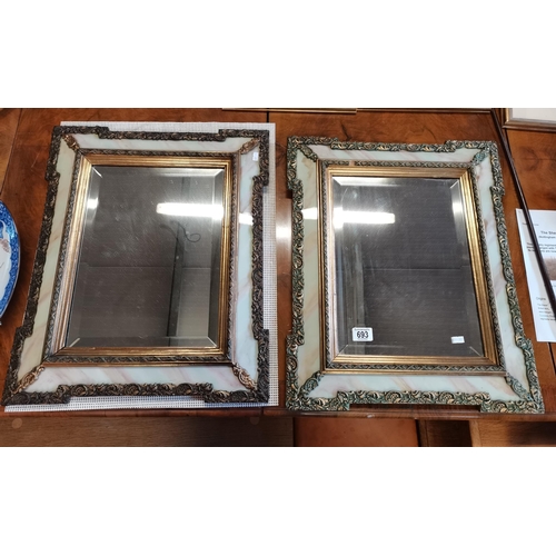 693 - A pair of gilt and marble effect wall mirrors 60cm x 50cm