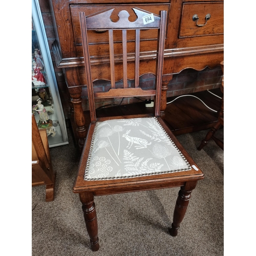 694 - A mahogany bedroom chair with newly covered rabbit fabric