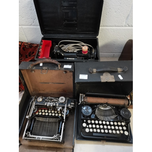 704 - 2 x vintage typewriters and Singer sewing machine