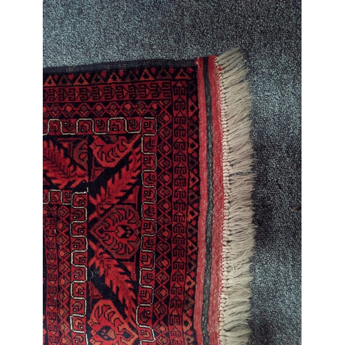 915 - A mostly red and blue rug 1.9m x 1.2m