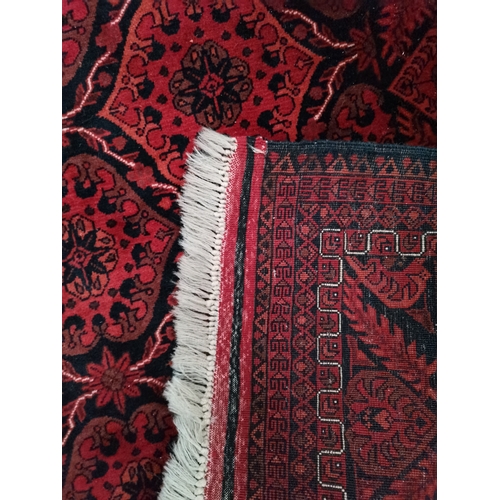 915 - A mostly red and blue rug 1.9m x 1.2m