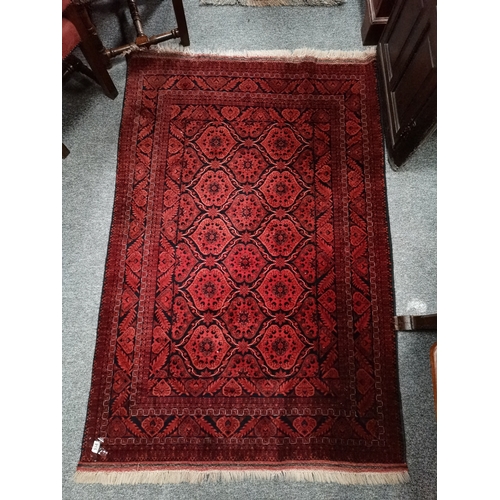 915 - A mostly red and blue rug 1.9m x 1.2m