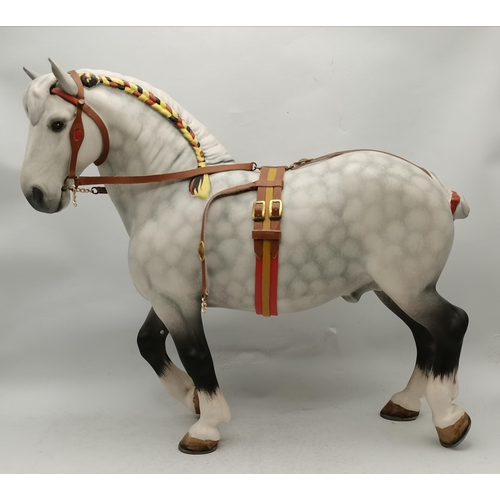 119 - A Beswick Percheron horse in show harness, model no. 2464, matt dappled grey. 24.3cm high