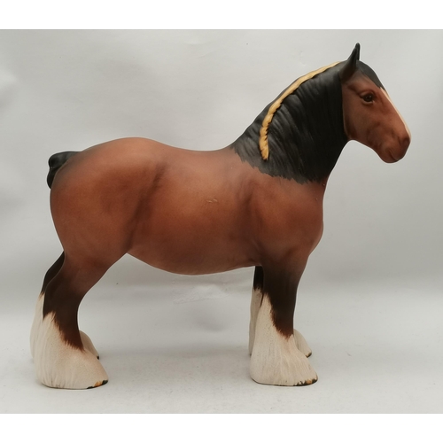 120 - A Beswick shire mare horse, model no. 818, matt brown. 21.5cm high