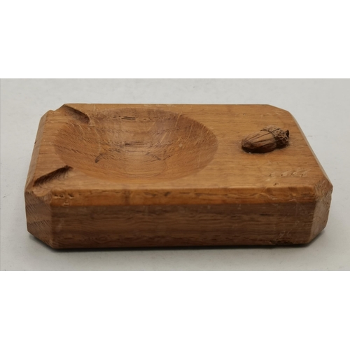 145 - Alan Grainger, an Acornman oak ashtray, of typical form, with carved acorn signature. 10.1cm by 6.9c... 