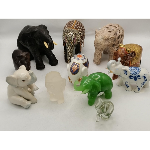 15 - A collection of various Elephant ornaments x11 -  including carved woos, carved stone, glass