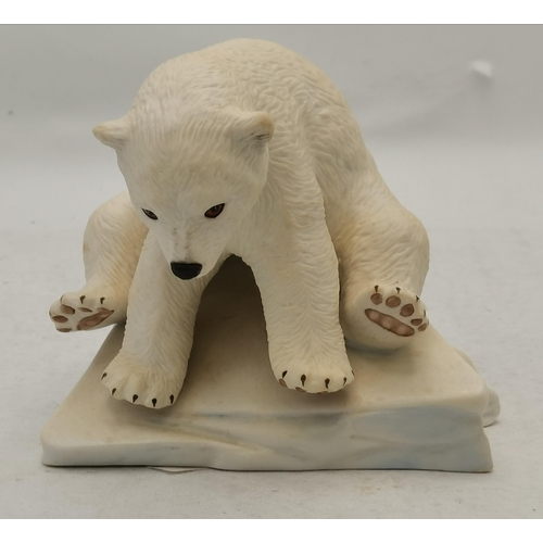 16 - A collection of porcelain animals including Elephants, Wallaby, Polar Bear, Panda and penguin