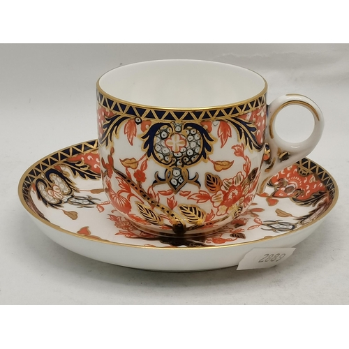 167 - Royal Crown Derby Imari coffee Cup and Saucer plus a pair of Early 19th century Tapering sticks both... 