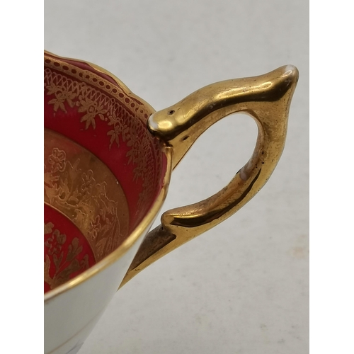 170 - A Royal Stafford red band with gold pedestal tea cup and saucer