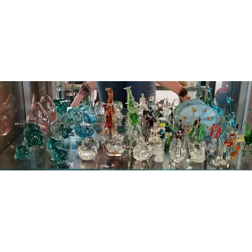 18 - A large collection of vintage miniature handblown glass and crystal figurines including Swarovski cr... 