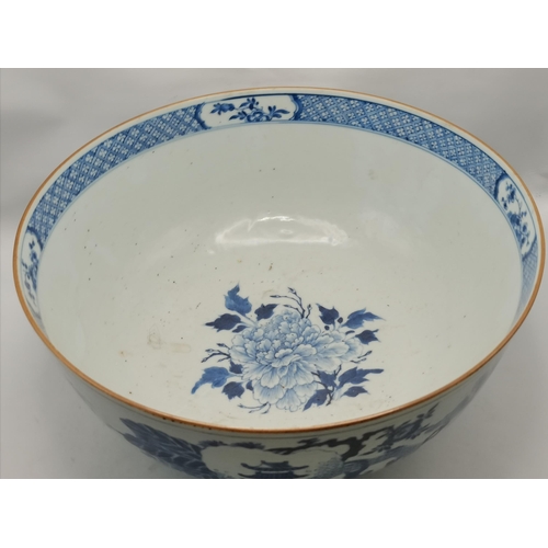 191 - A large blue and white ceramic punch bowl, early 19th Century, decorated in the Chinese taste with f... 