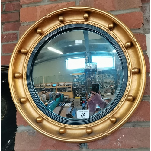 24 - A Regency-style gilt convex mirror, circular. 41.5cm diameter