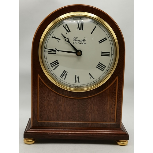 5 - A mahogany arch-top mantel clock by Comitti, London, mid-20th Century, the 4-inch cream circular dia... 