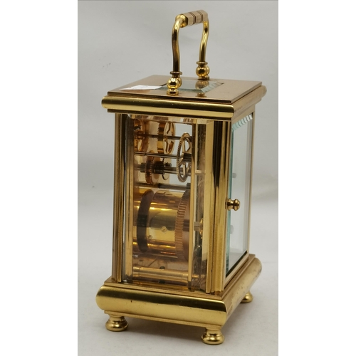 6 - An English brass carriage clock by Angelus, 20th Century, 11 Jewels, the rectangular cream dial with... 