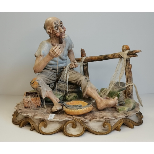 81 - Large Italian Figure possibly Balsano of old man mending fishing nets - W36cm x H28cm