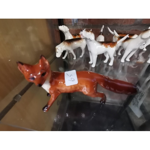 93 - Beswick 11 foxhounds & 1 Fox