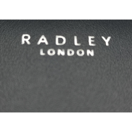 294 - New dark blue Radley leather purse with dust bag and box 