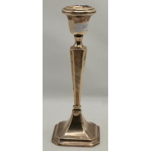 299 - A George V silver candlestick by John & William F Deakin, Chester 1918, the tapering octagonal stem ... 