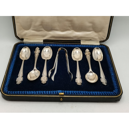 338 - A group of mixed silver including a pair of George V serving spoons by Cooper Brothers & Sons Ltd, S... 