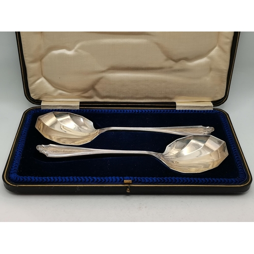 338 - A group of mixed silver including a pair of George V serving spoons by Cooper Brothers & Sons Ltd, S... 