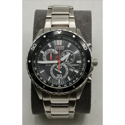 388 - A gent's Citizen Eco-Drive steel bracelet chronograph wristwatch, with black and grey dial, cased.