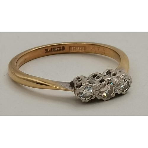 394 - A 9 carat gold and platinum three-stone ring, set with three white stones. Ring size O, 2.2g gross, ... 