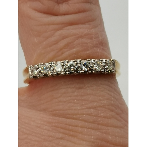 397 - An 18 carat gold half hoop seven-stone ring, likely diamonds (not tested). Ring size P1/2, 3.3g gros... 