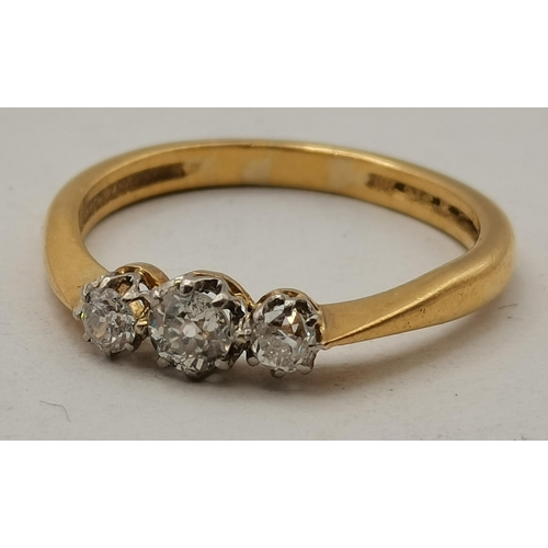 398 - A yellow metal three-stone ring, likely 9ct (not tested), with three white stones in claw settings. ... 