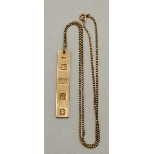 400A - A 9 carat gold ingot pendant necklace on chain, narrow rectangular, hallmarked and struck '375', on ... 