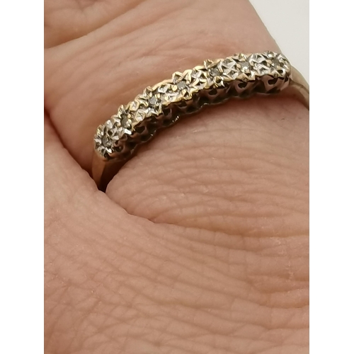 405 - Yellow Gold Stamped '375' Eternity ring with a band of white stones