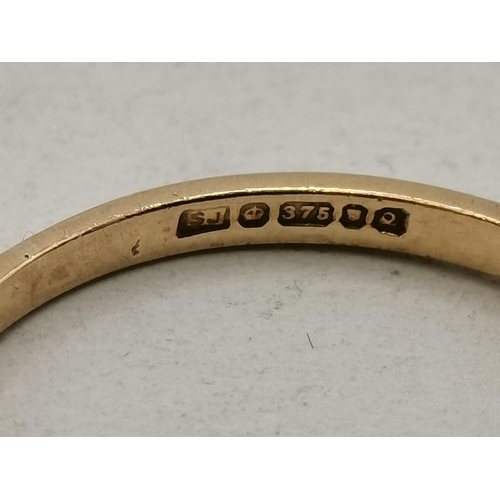 405 - Yellow Gold Stamped '375' Eternity ring with a band of white stones