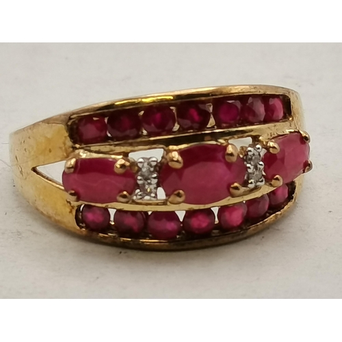 408 - Cocktail ring with 3 rows of red (possibly Ruby) stones with 2 small white stones set in 9ct Gold st... 