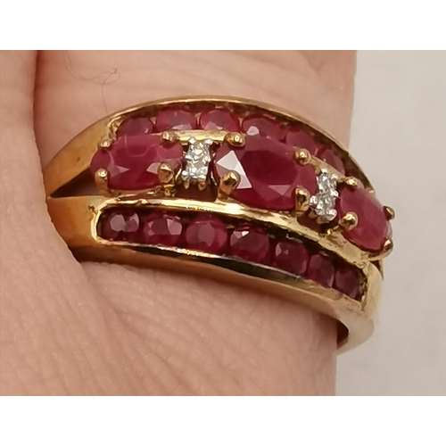 408 - Cocktail ring with 3 rows of red (possibly Ruby) stones with 2 small white stones set in 9ct Gold st... 