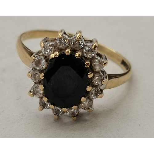 432 - A small quantity of jewellery including a 9 carat gold ring set with a large blue stone surrounded b... 