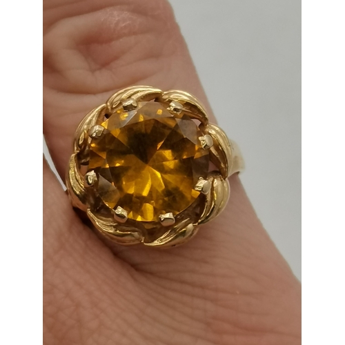 450M - A 14 carat gold citrine cocktail ring, hallmarked, stamped '585'. Ring size P1/2, approx. 8ct citrin... 