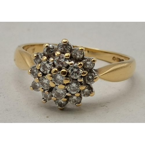 452 - 18ct Yellow Gold Diamond cluster ring Size L  - Diamonds are set in a claw setting stamped 750 and h... 