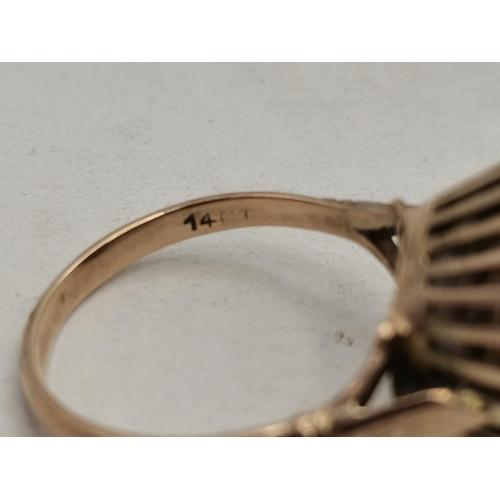 461 - Two dress rings, comprising a 14 carat gold large single stone ring in a claw setting, marked '14', ... 