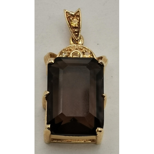 465 - A 9 carat gold smoky quartz and citrine pendant, the rectangular stone to a shaped gold and three ci... 